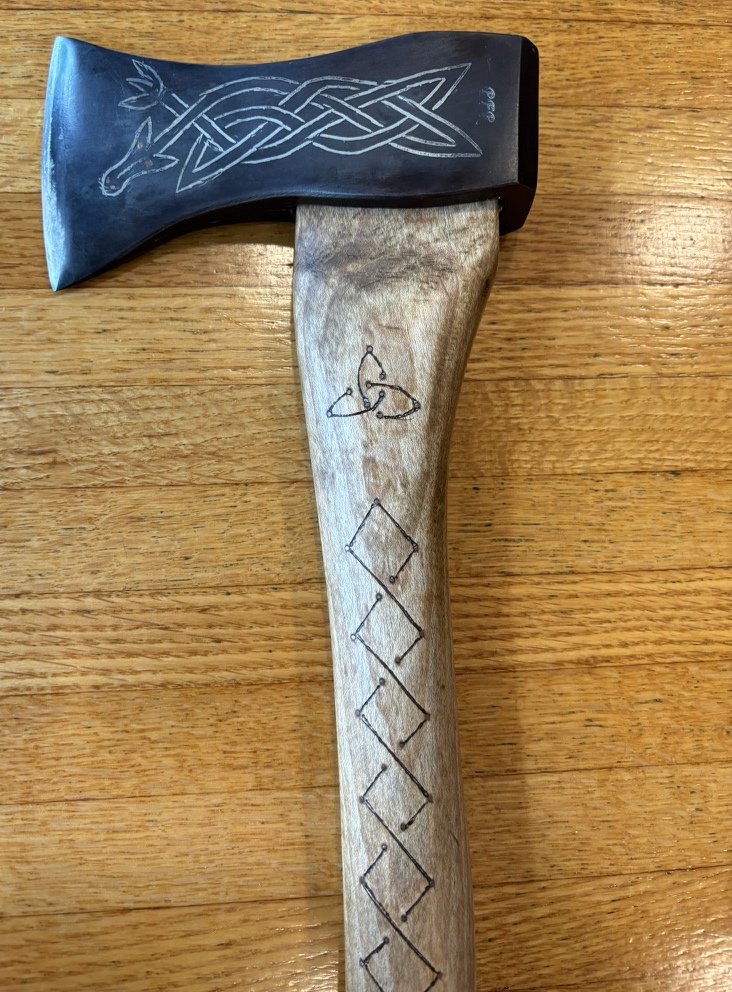 Hand-forged axe with engraved design by Paul Rohrbach